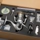 Fishing reel securely packed in sturdy cardboard box with accessories.