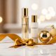 An elegant luxury perfume gift set displayed on a marble surface with a gold ribbon and soft lighting