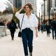 Chicago fashion blogger styling a loose oversized shirt with a smart front tuck in downtown street fashion