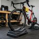 A bike front wheel riser block placed under the front tire of a road bike on an indoor trainer